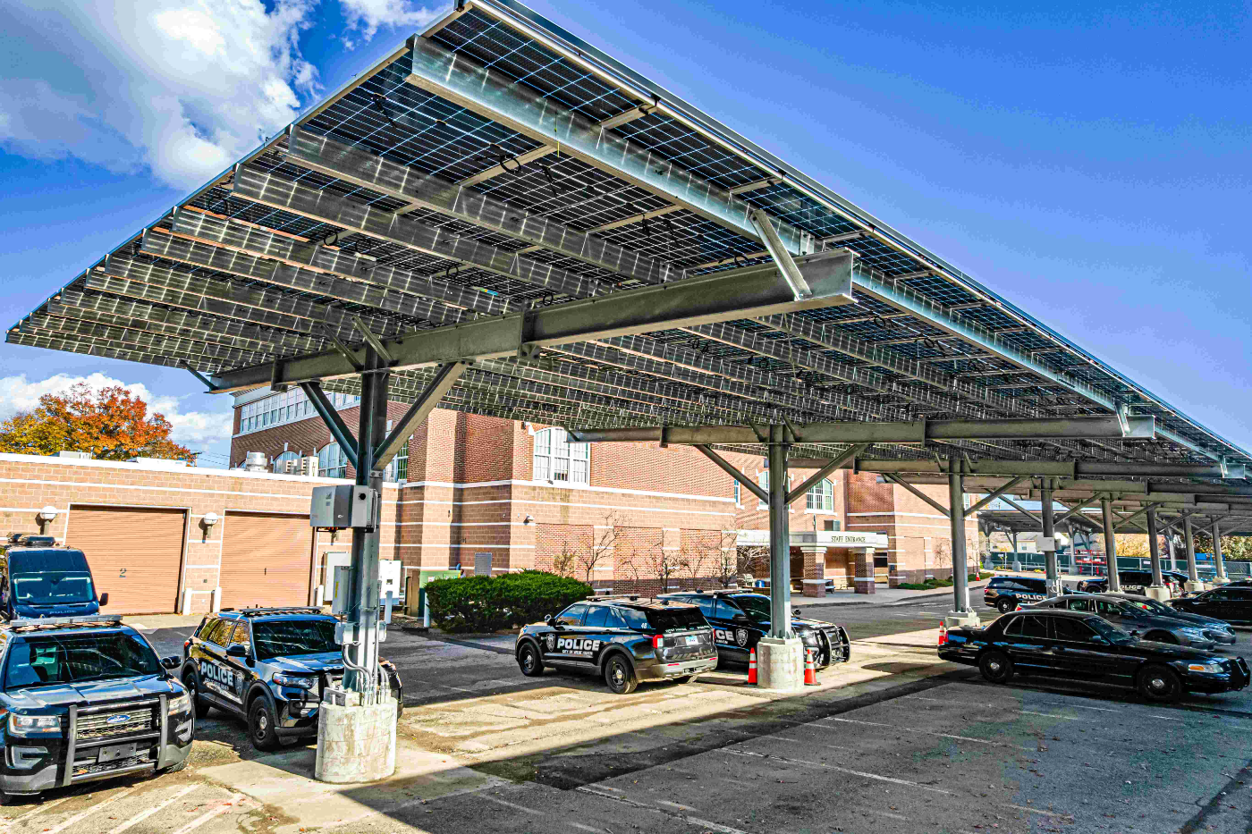 Long-span solar carport over a commercial parking lot